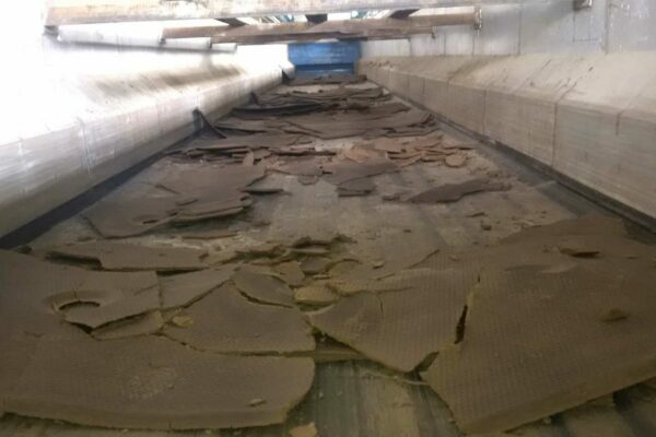 Interior of dewatering chamber with bioethanol sludge drying on plates