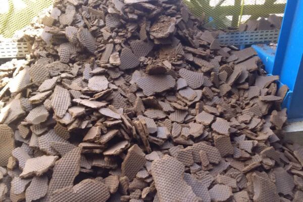 Close-up of dried sludge cake fragments from bioethanol filtration