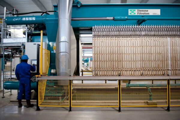 Technician operating filtration equipment at Antwerp sediment treatment site