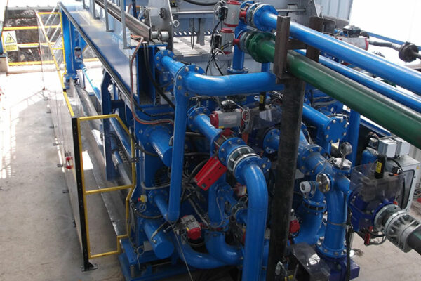 Close-up of modular filtration piping and instrumentation in mine dewatering system