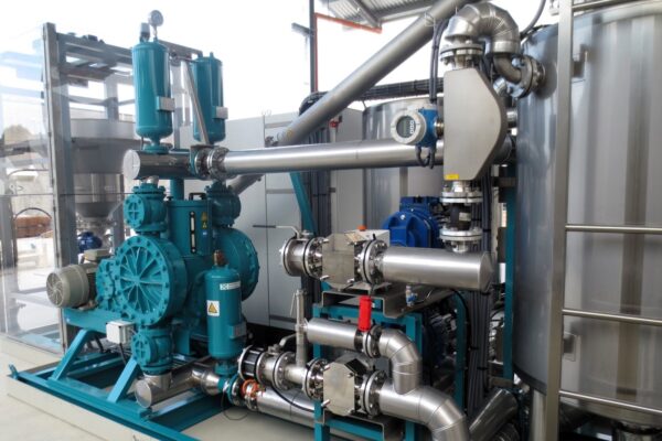 Close-up of pump skid piping and valves in modular pump system